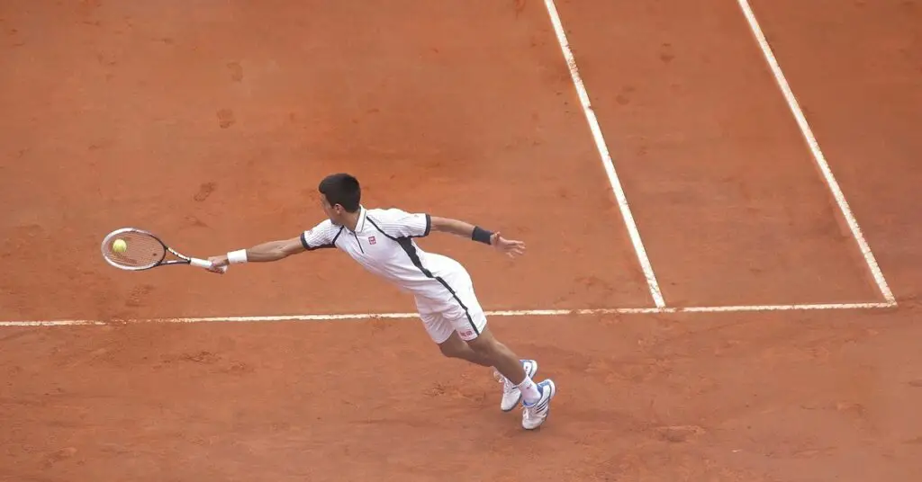 Novak Djokovic jumping for backhand shot