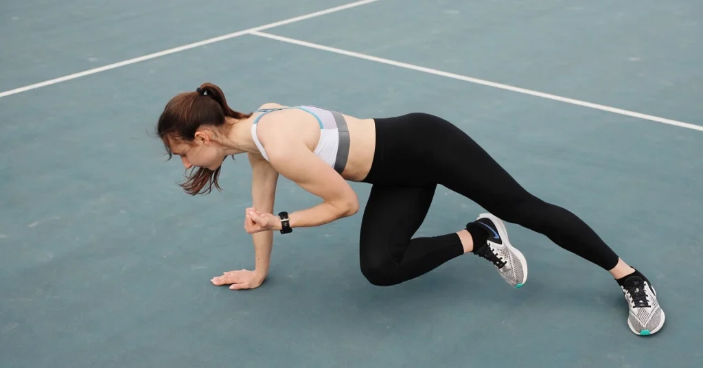 tennis player stretching holding