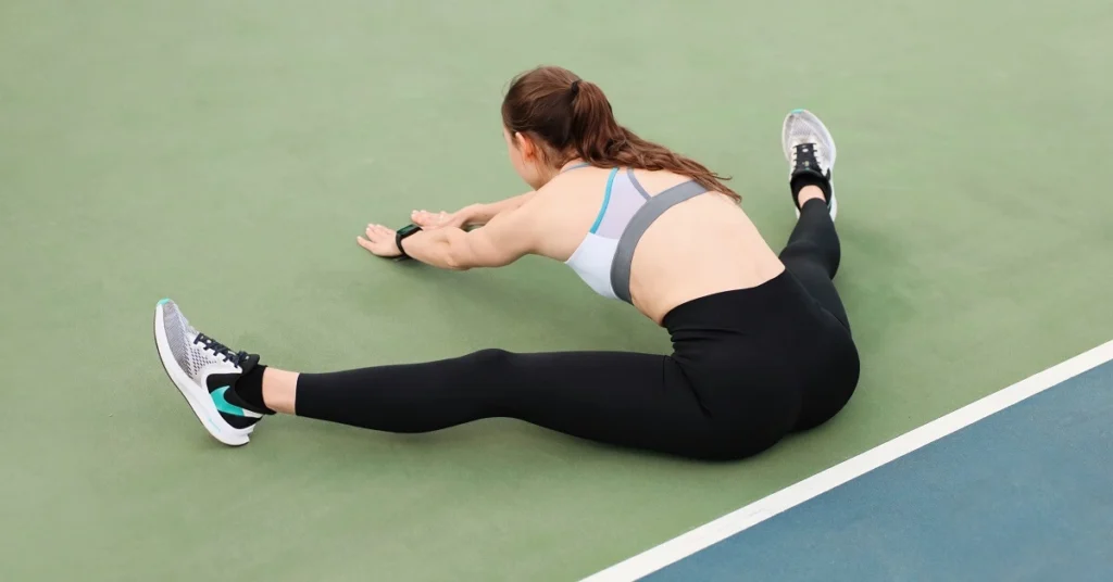 tennis player stretching upper body