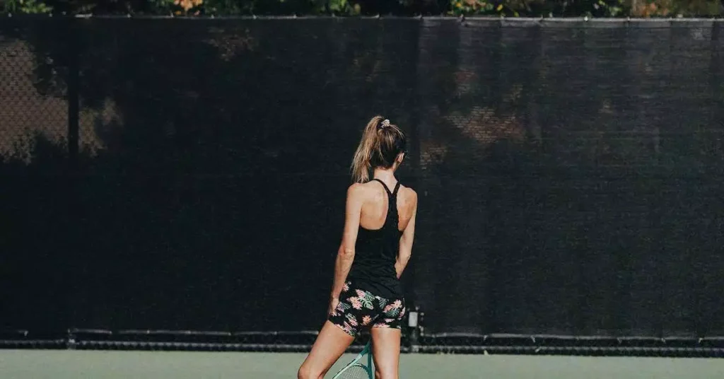 girl looking on a tennis court windscreen