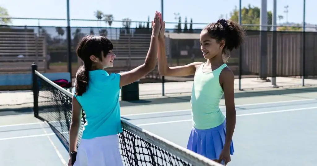 young tennis players handshaking
