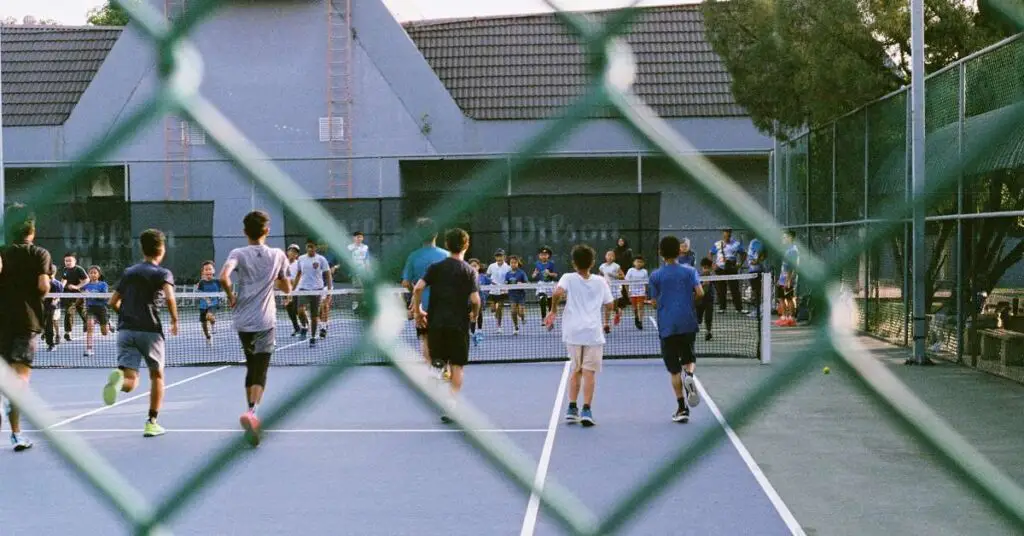 group of children on tennis court