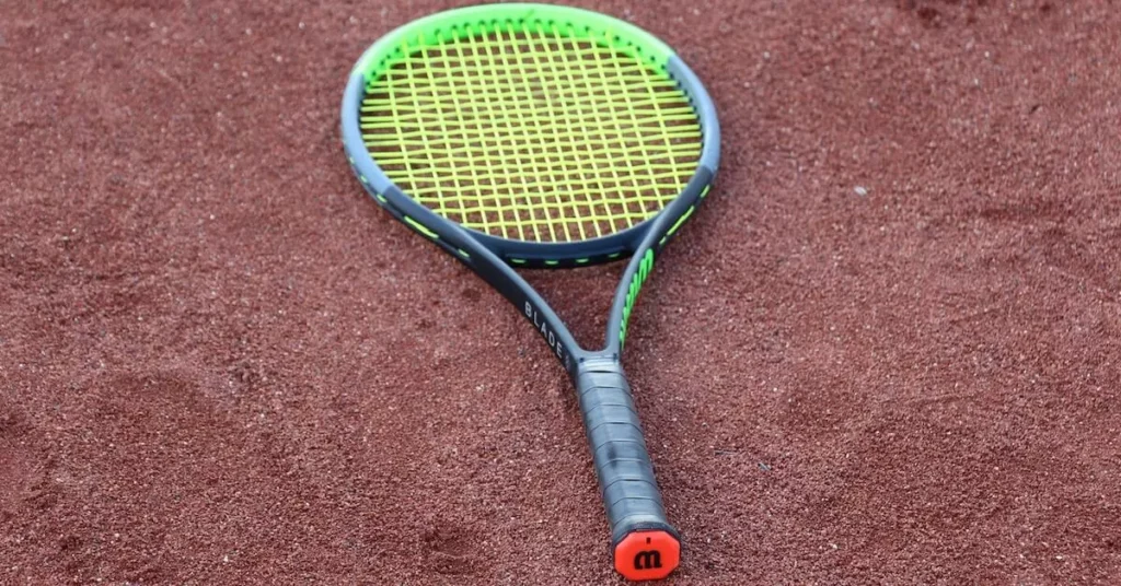 tennis racket on the clay court